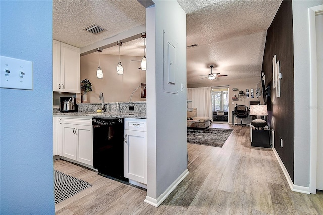 10670 43rd St N Unit 204, Clearwater, FL 33762 - kitchen featuring a textured ceiling, dishwasher, light wood-style floors, white cabinets, and open floor plan