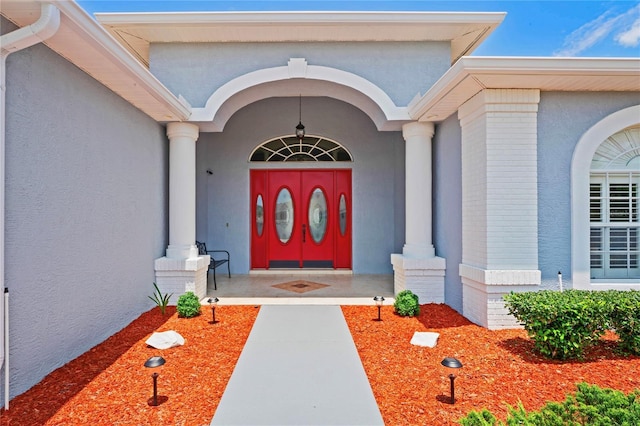 10250 Locker Dr, Spring Hill, FL 34608 - entrance to property with brick siding, covered porch, and stucco siding