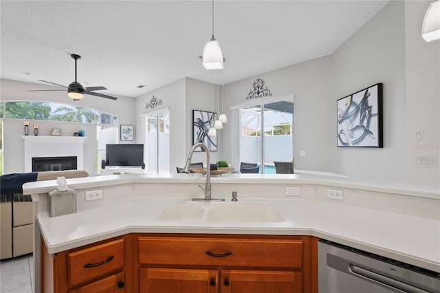 10250 Locker Dr, Spring Hill, FL 34608 - kitchen with dishwasher, open floor plan, a sink, light countertops, and a ceiling fan