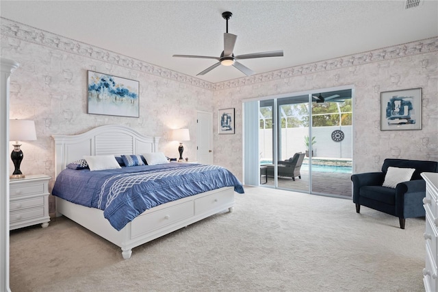 10250 Locker Dr, Spring Hill, FL 34608 - carpeted bedroom with access to outside, wallpapered walls, a textured ceiling, and ceiling fan