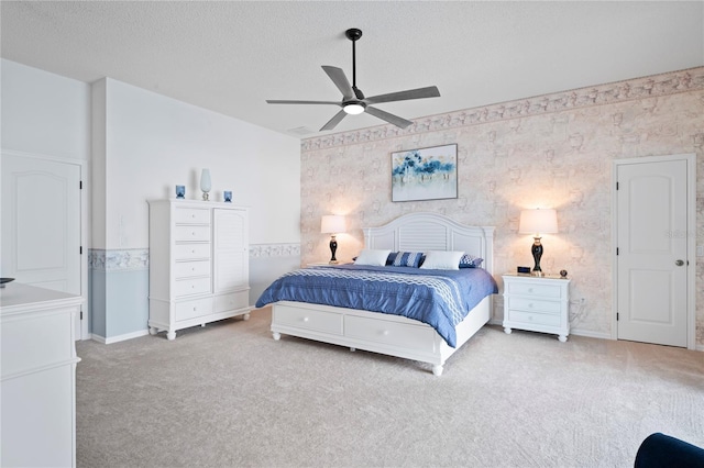 10250 Locker Dr, Spring Hill, FL 34608 - carpeted bedroom with wallpapered walls, baseboards, a textured ceiling, and a ceiling fan