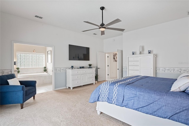 10250 Locker Dr, Spring Hill, FL 34608 - bedroom featuring light colored carpet, ensuite bath, and ceiling fan