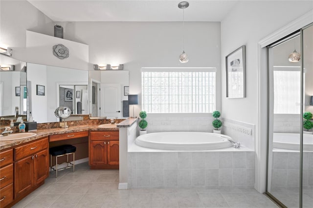 10250 Locker Dr, Spring Hill, FL 34608 - full bath featuring a bath, double vanity, and tile patterned flooring