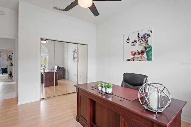 10250 Locker Dr, Spring Hill, FL 34608 - home office featuring ceiling fan, light wood-style flooring, and baseboards