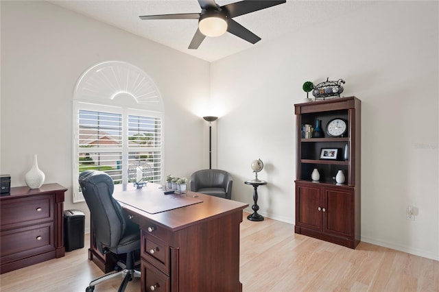 10250 Locker Dr, Spring Hill, FL 34608 - office area with a ceiling fan and light wood-style floors