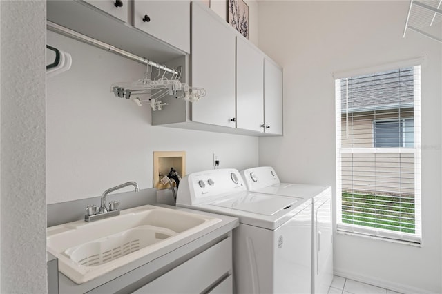 10250 Locker Dr, Spring Hill, FL 34608 - laundry area featuring cabinet space, separate washer and dryer, and light tile patterned floors