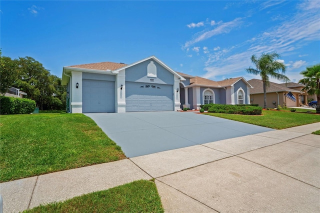 10250 Locker Dr, Spring Hill, FL 34608 - ranch-style house with an attached garage, a front yard, concrete driveway, and stucco siding