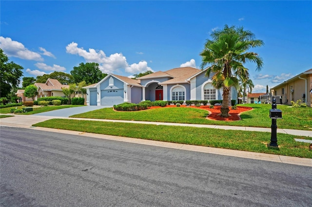 10250 Locker Dr, Spring Hill, FL 34608 - view of front facade featuring concrete driveway, an attached garage, a front yard, and stucco siding
