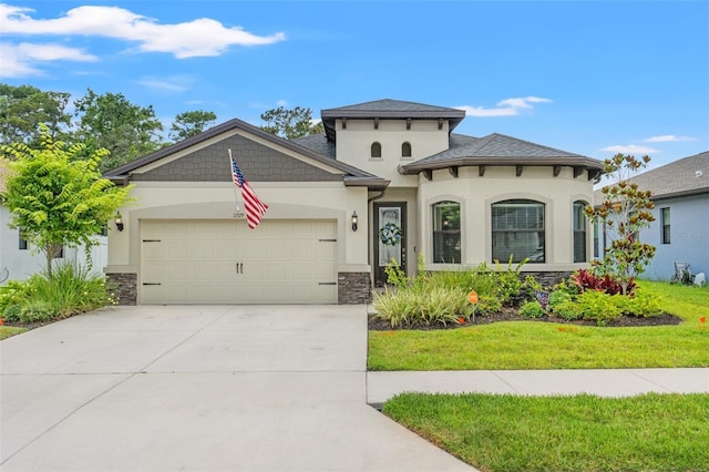 11579 Weaver Hollow Rd, New Port Richey, FL 34654 - view of front of house featuring stone siding, an attached garage, stucco siding, driveway, and a front lawn