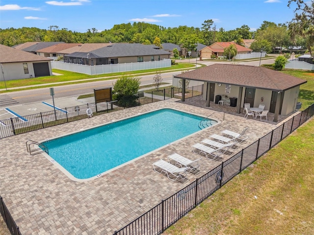11579 Weaver Hollow Rd, New Port Richey, FL 34654 - community pool with a residential view and a patio