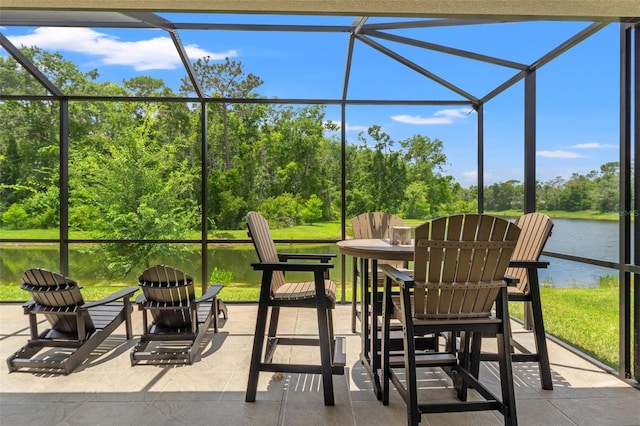 11579 Weaver Hollow Rd, New Port Richey, FL 34654 - view of patio / terrace featuring a water view, a lanai, and view of wooded area