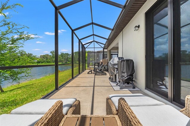 11579 Weaver Hollow Rd, New Port Richey, FL 34654 - view of patio with a water view and a lanai