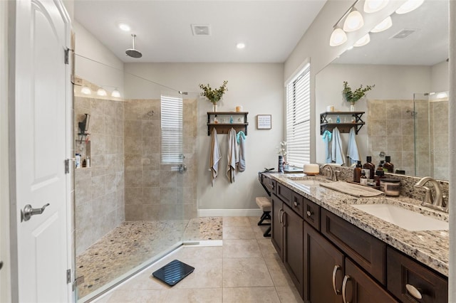 11579 Weaver Hollow Rd, New Port Richey, FL 34654 - full bathroom featuring tiled shower, tile patterned flooring, double vanity, and baseboards