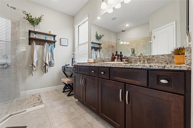 11579 Weaver Hollow Rd, New Port Richey, FL 34654 - bathroom with walk in shower, baseboards, tile patterned flooring, and vanity
