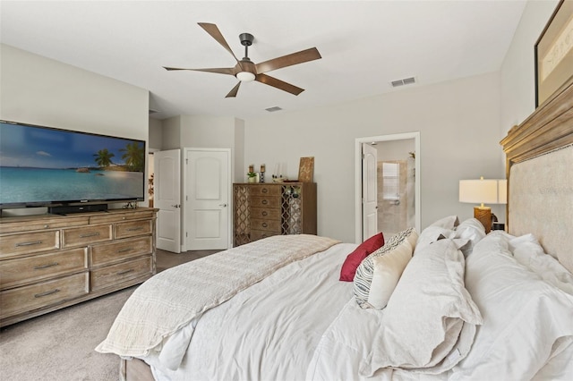 11579 Weaver Hollow Rd, New Port Richey, FL 34654 - bedroom with dark colored carpet, a ceiling fan, and ensuite bathroom