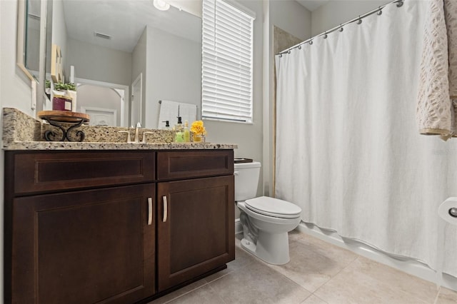 11579 Weaver Hollow Rd, New Port Richey, FL 34654 - full bathroom featuring toilet, vanity, and tile patterned flooring