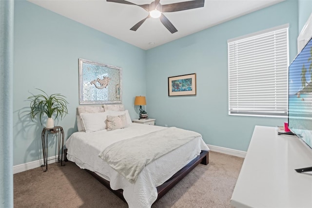 11579 Weaver Hollow Rd, New Port Richey, FL 34654 - bedroom with carpet floors, baseboards, and a ceiling fan