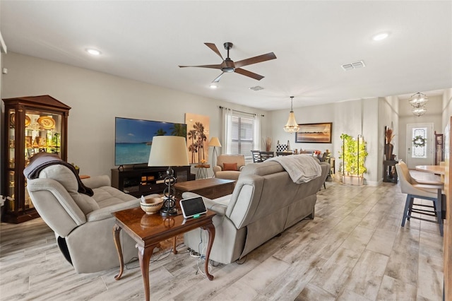 11579 Weaver Hollow Rd, New Port Richey, FL 34654 - living room with ceiling fan, light wood-style floors, and recessed lighting