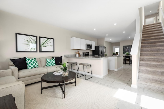 2307 Incandescent Way S, Daytona, FL 32119 - living room with stairs, light tile patterned flooring, baseboards, and recessed lighting