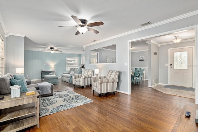 4851 NE 7th St, Ocala, FL 34470 - living room with ceiling fan, plenty of natural light, wood finished floors, baseboards, and crown molding