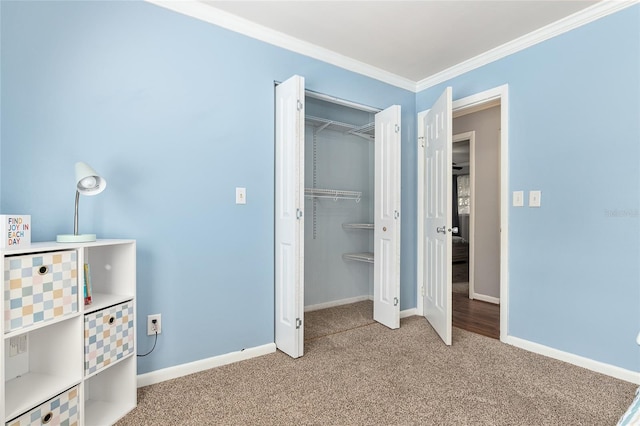 4851 NE 7th St, Ocala, FL 34470 - unfurnished bedroom with carpet, crown molding, baseboards, and a closet