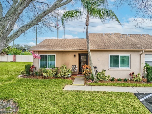 3832 Sailmaker Ln Unit 3832, Holiday, FL 34691 - view of front of home with a shingled roof and stucco siding