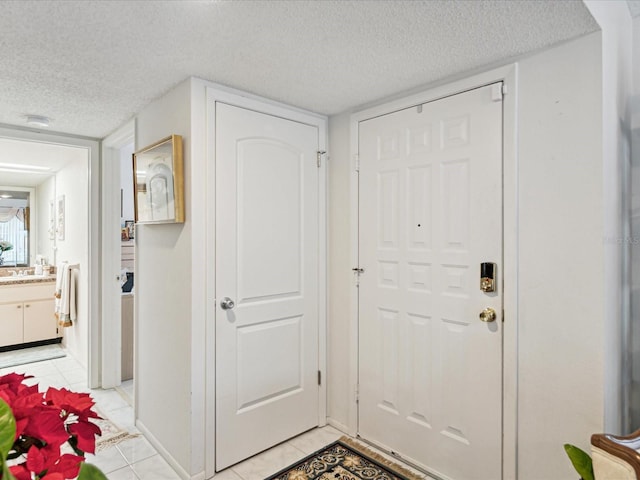 3832 Sailmaker Ln Unit 3832, Holiday, FL 34691 - entryway featuring a textured ceiling and light tile patterned floors