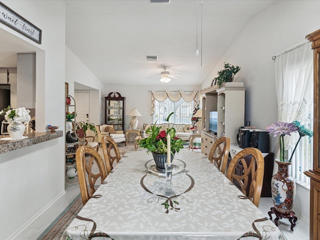 3832 Sailmaker Ln Unit 3832, Holiday, FL 34691 - dining room featuring a ceiling fan, vaulted ceiling, and baseboards