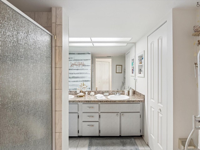 3832 Sailmaker Ln Unit 3832, Holiday, FL 34691 - full bathroom with double vanity, a shower stall, and tile patterned flooring