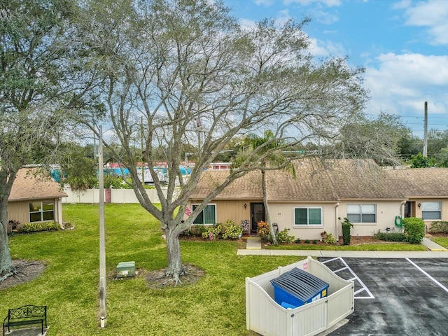 3832 Sailmaker Ln Unit 3832, Holiday, FL 34691 - view of front of property featuring uncovered parking and stucco siding