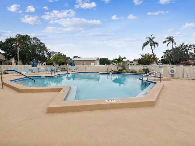 3832 Sailmaker Ln Unit 3832, Holiday, FL 34691 - community pool with a patio area