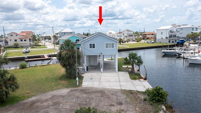 6322 Aureau Ave, Hudson, FL 34667 - dock featuring a residential view, a water view, a lawn, and stairs