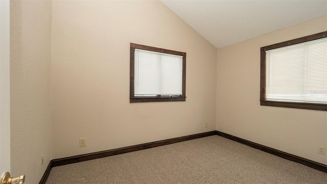 6322 Aureau Ave, Hudson, FL 34667 - unfurnished room featuring vaulted ceiling, carpet flooring, and baseboards