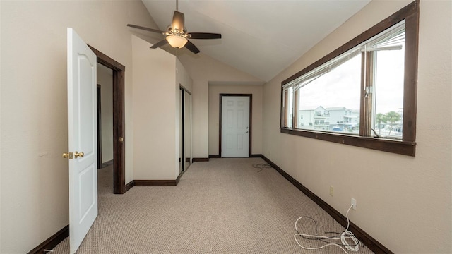 6322 Aureau Ave, Hudson, FL 34667 - hallway featuring lofted ceiling, light carpet, and baseboards