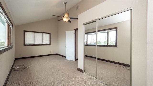 6322 Aureau Ave, Hudson, FL 34667 - unfurnished bedroom featuring carpet, multiple windows, vaulted ceiling, and a closet