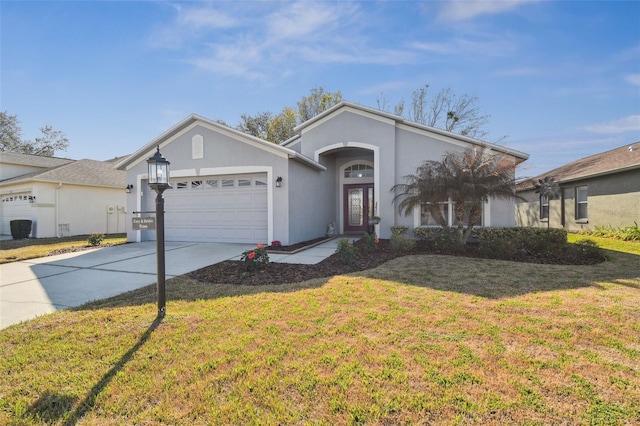 11637 Spindrift Loop, Hudson, FL 34667 - single story home with driveway, a garage, a front lawn, and stucco siding