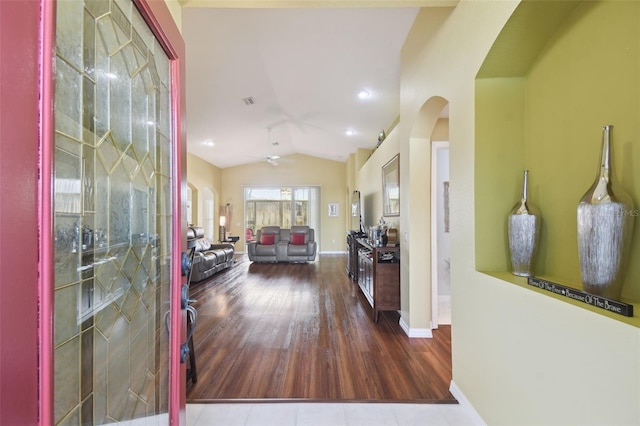 11637 Spindrift Loop, Hudson, FL 34667 - foyer featuring arched walkways, lofted ceiling, wood finished floors, and a ceiling fan