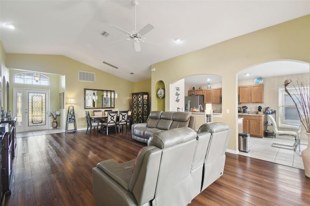 11637 Spindrift Loop, Hudson, FL 34667 - living area featuring arched walkways, light wood-style flooring, lofted ceiling, and ceiling fan