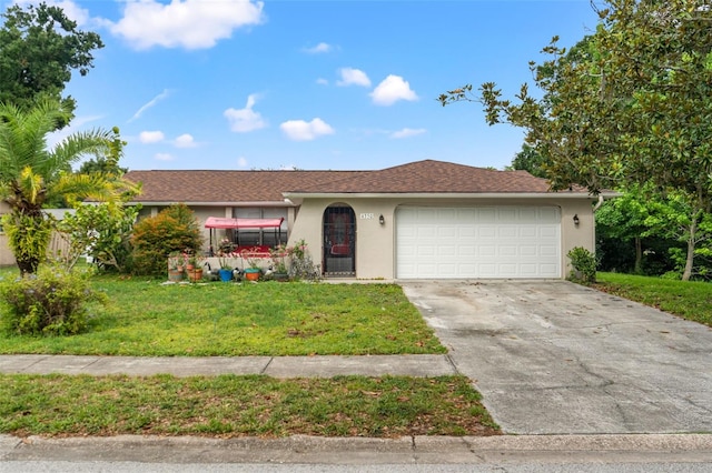 4350 Sawgrass Blvd, New Port Richey, FL 34653 - ranch-style house featuring stucco siding, an attached garage, a front lawn, and concrete driveway