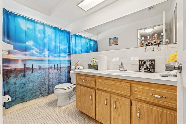 4350 Sawgrass Blvd, New Port Richey, FL 34653 - full bath with tile patterned floors, vanity, toilet, and tile walls