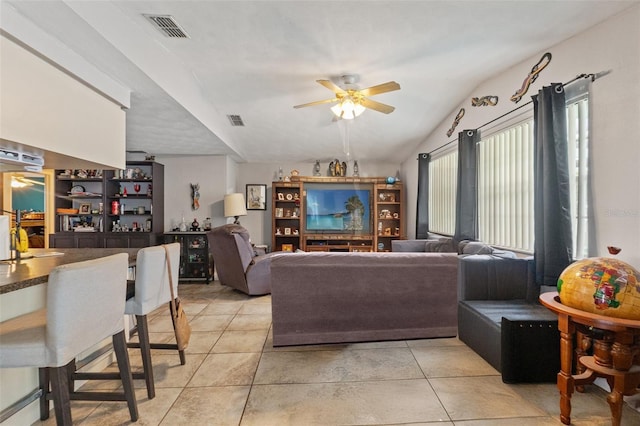 4350 Sawgrass Blvd, New Port Richey, FL 34653 - living area with a ceiling fan, vaulted ceiling, and light tile patterned floors