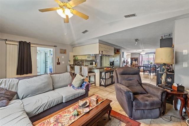 4350 Sawgrass Blvd, New Port Richey, FL 34653 - living room with ceiling fan, light tile patterned floors, and lofted ceiling