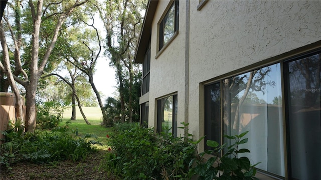 13012 Wedgewood Way Unit A, Hudson, FL 34667 - view of property exterior with stucco siding