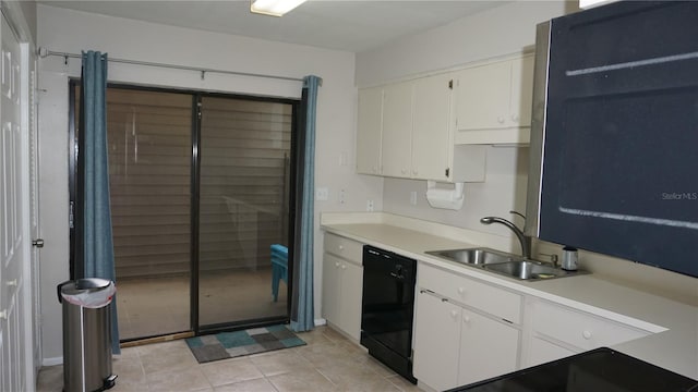 13012 Wedgewood Way Unit A, Hudson, FL 34667 - kitchen with black dishwasher, light countertops, white cabinetry, and a sink