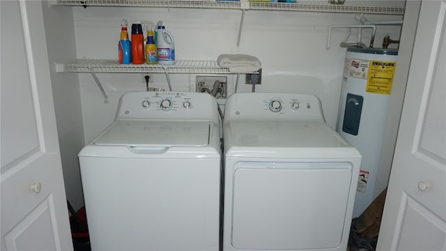 13012 Wedgewood Way Unit A, Hudson, FL 34667 - washroom with washer and dryer and electric water heater