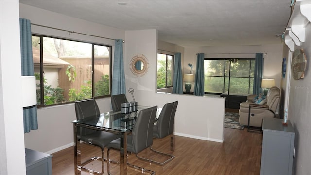 13012 Wedgewood Way Unit A, Hudson, FL 34667 - dining area with wood finished floors and baseboards