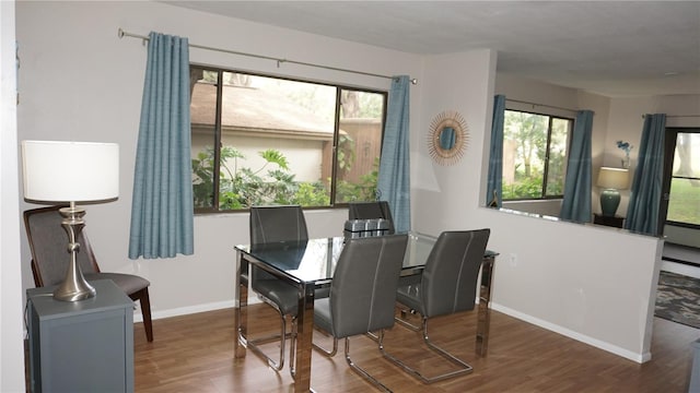 13012 Wedgewood Way Unit A, Hudson, FL 34667 - dining area featuring wood finished floors and baseboards