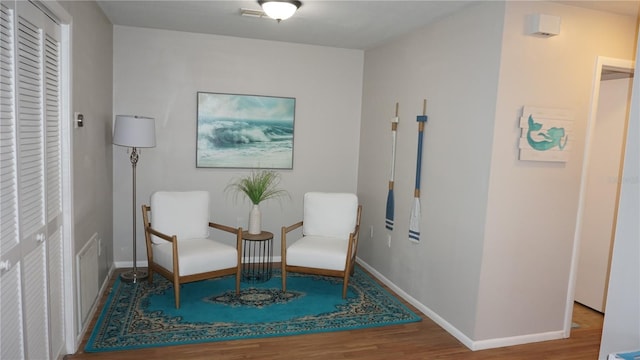 13012 Wedgewood Way Unit A, Hudson, FL 34667 - sitting room with wood finished floors and baseboards