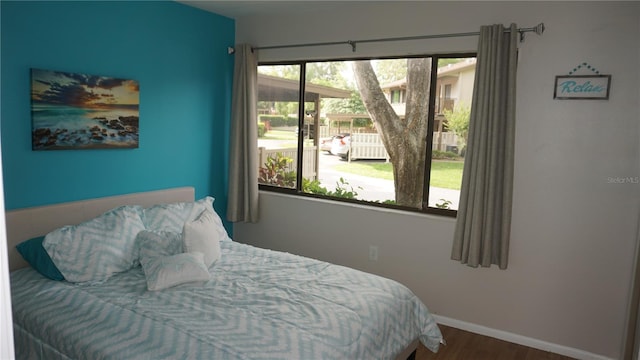13012 Wedgewood Way Unit A, Hudson, FL 34667 - bedroom with wood finished floors and baseboards