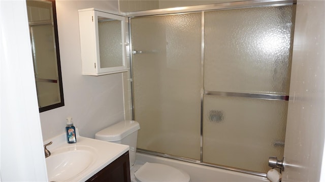 13012 Wedgewood Way Unit A, Hudson, FL 34667 - bathroom with toilet, vanity, and combined bath / shower with glass door